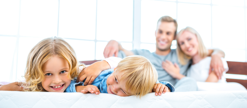 Family in hotel bed