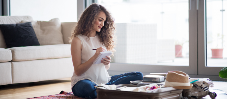 Lady writing packing list