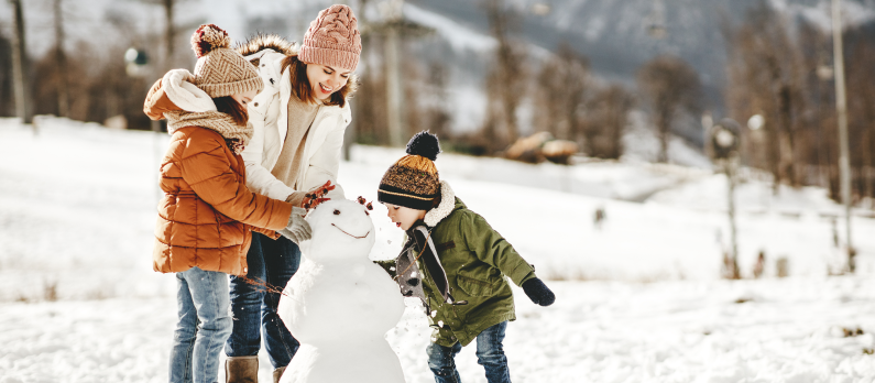 Family building snowman