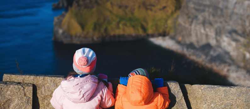 Kids looking at the cliffs of moher