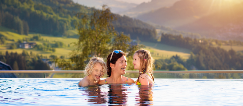 Mother and kids in outdoor pool